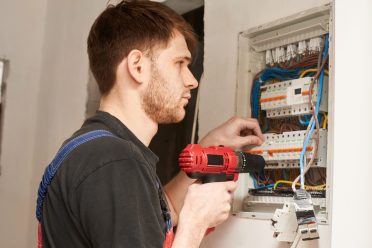 electrician-builder-engineer-screwing-equipment-in-2022-05-23-12-17-18-utc-min